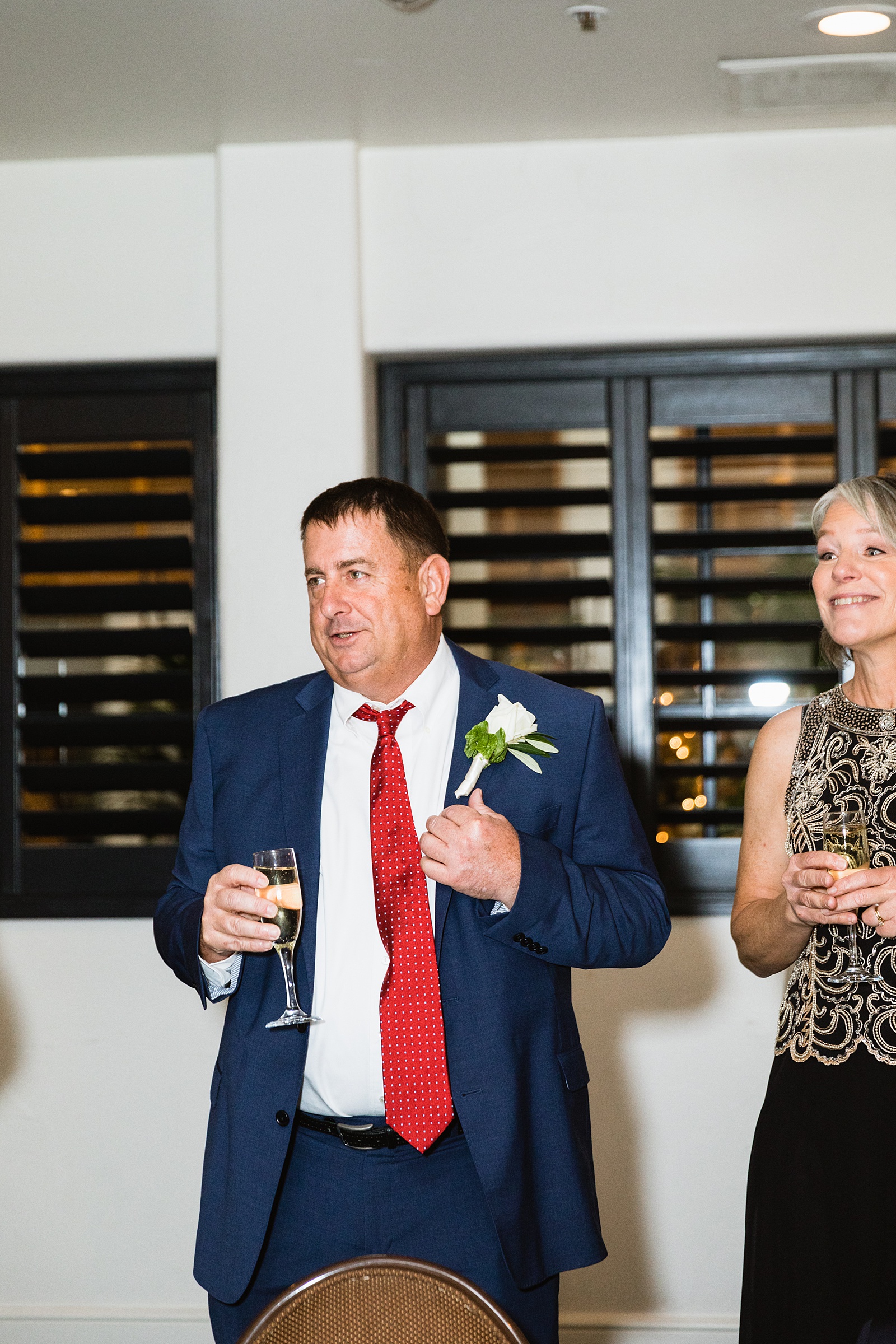 Guests make a toast at The Scott wedding reception by Scottsdale wedding photographer PMA Photography