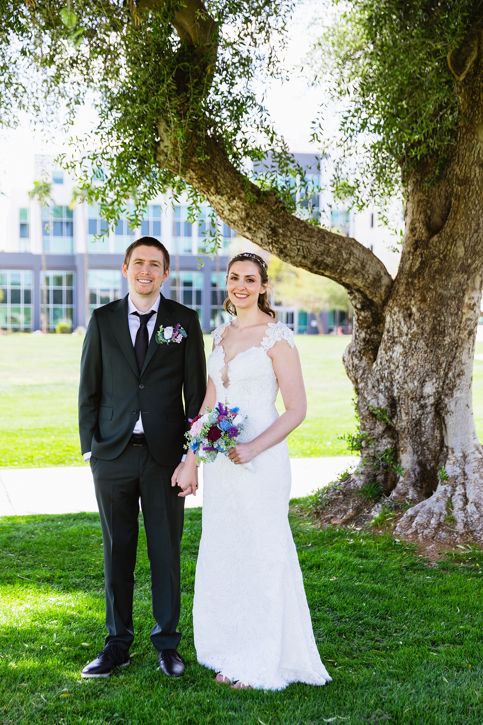 Bride and groom pose for their Chandler Community Center wedding by Chandler wedding photographer PMA Photography.