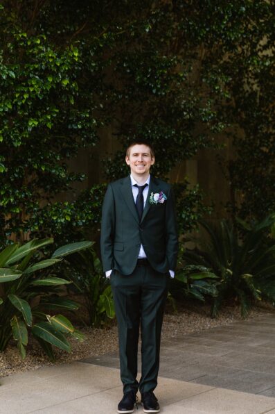 Groom's all black suit for his Chandler Community Center wedding by PMA Photography.
