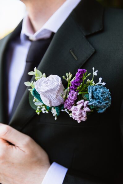 Groom's crocheted boutonniere by PMA Photography.
