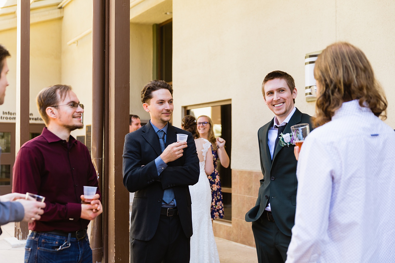 Bride and groom with guests at their Chandler Community Center Wedding by PMA Photography.