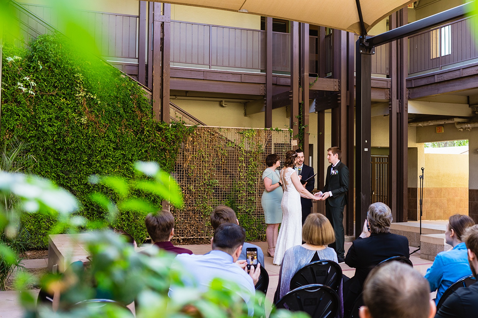 Wedding ceremony at Chandler Community Center by Phoenix wedding photographer PMA Photography.