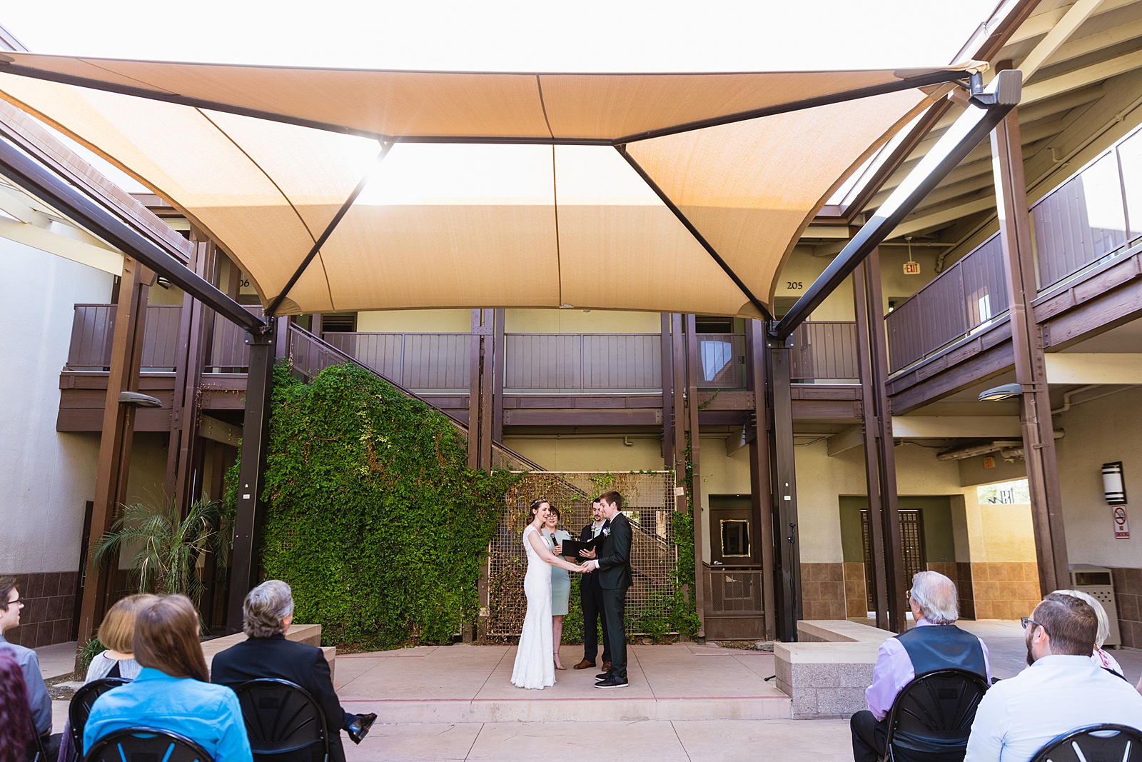 Wedding ceremony at Chandler Community Center by Phoenix wedding photographer PMA Photography.