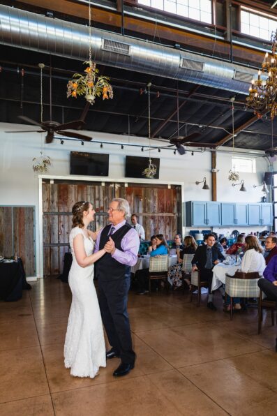 Bride dancing with guests at Hidden House wedding reception by Chandler wedding photographer PMA Photography