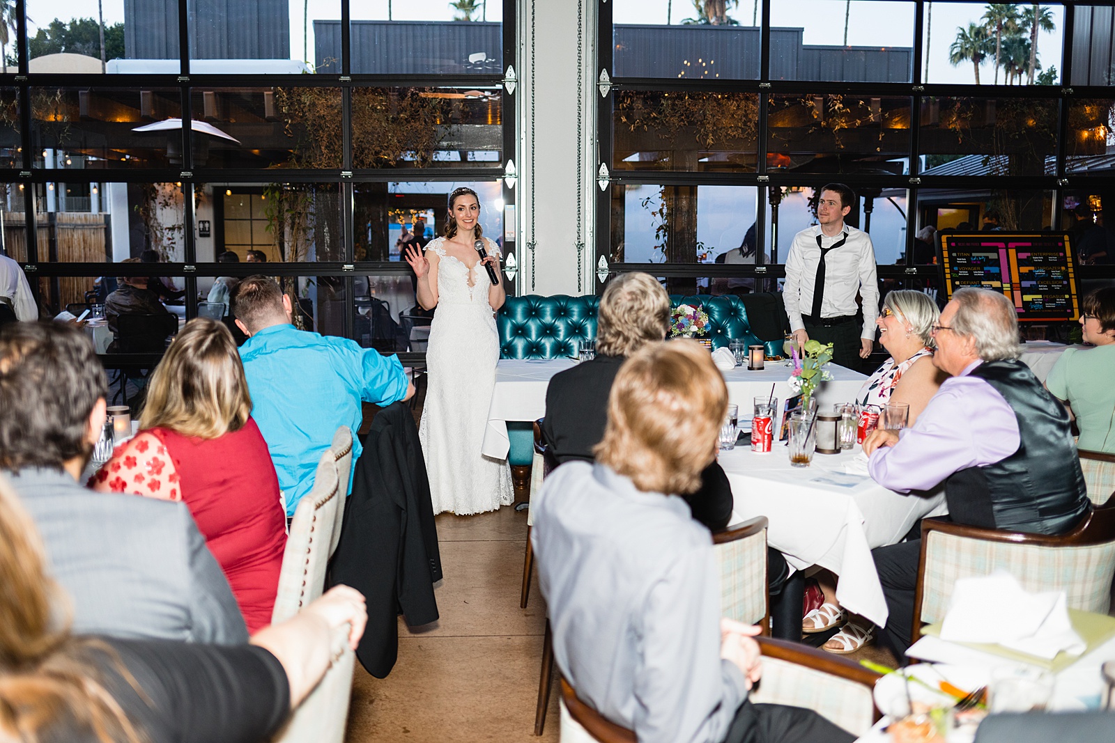 Toasts at Hidden House wedding reception by Chandler wedding photographer PMA Photography.