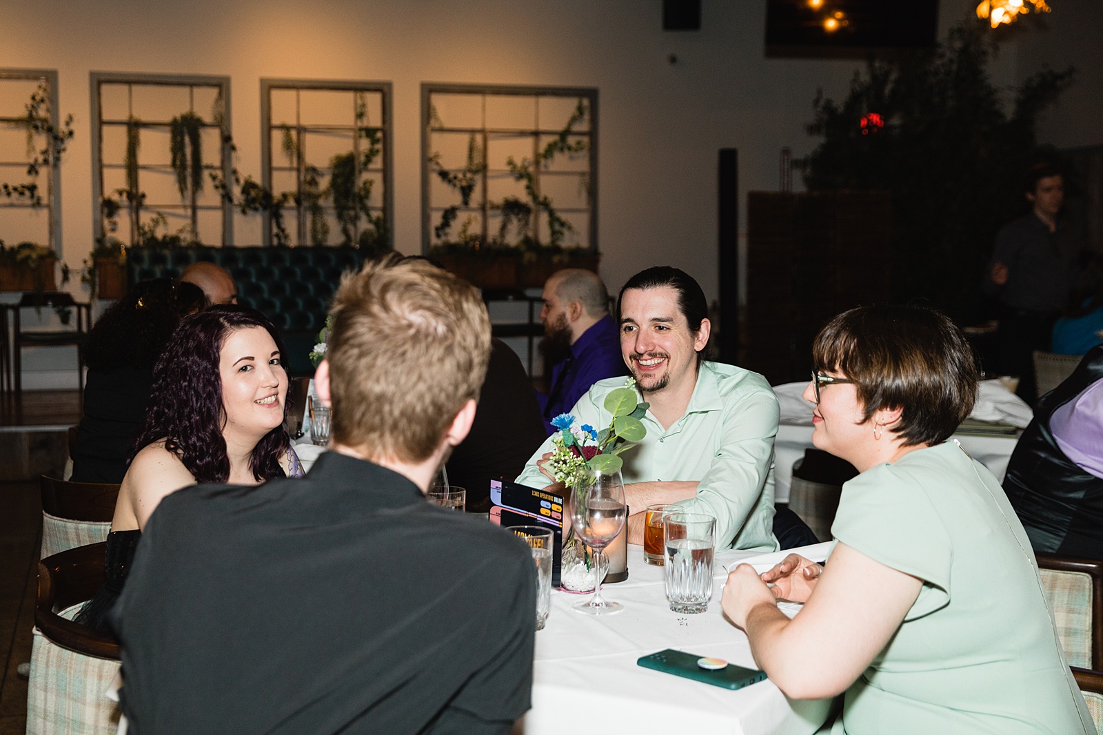 Guests together at Hidden House wedding reception by Chandler wedding photographer PMA Photography