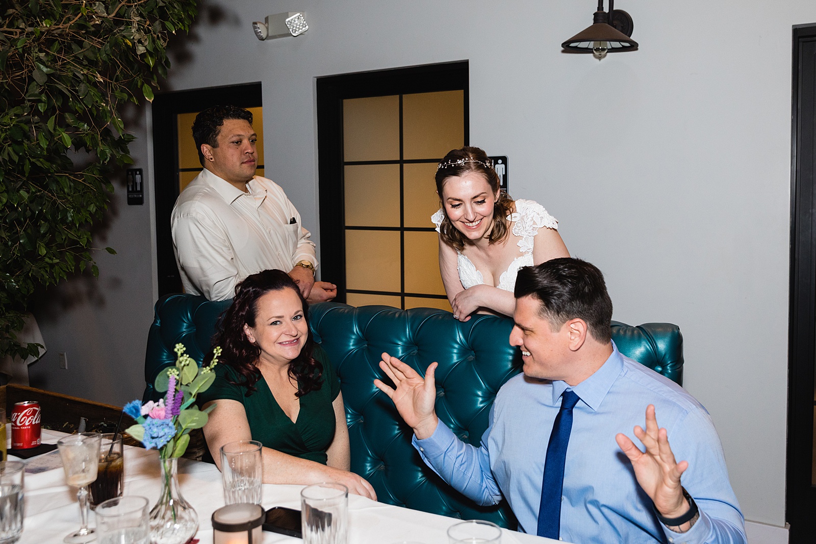 Bride with guests at Hidden House wedding reception by Chandler wedding photographer PMA Photography