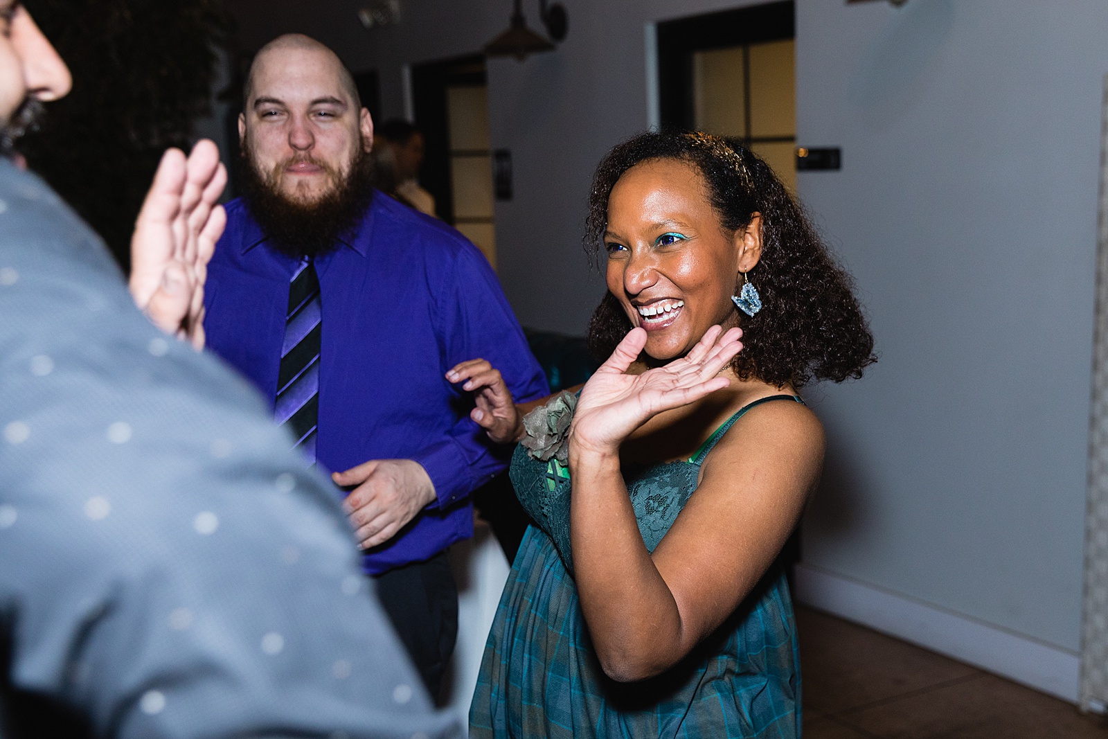 Guests dancing together at Hidden House wedding reception by Chandler wedding photographer PMA Photography