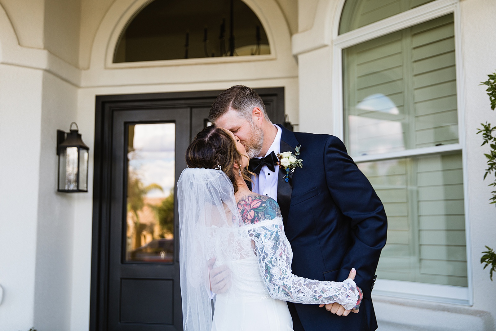 Bride and groom share an intimate moment during their first look at their backyard wedding by Phoenix wedding photographer PMA Photography.