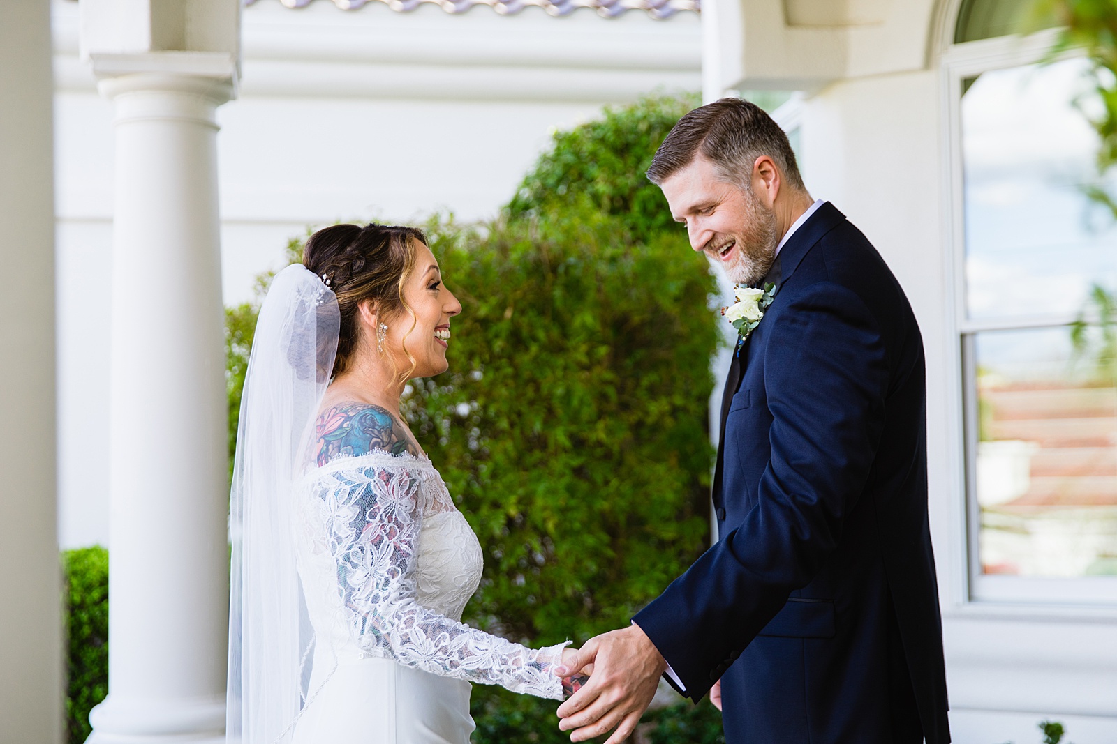 Bride and groom's first look at their backyard wedding by Phoenix wedding photographer PMA Photography.