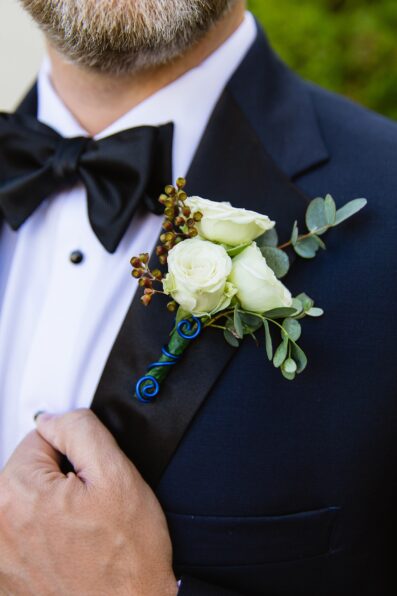 Groom's wire wrapped boutonniere by PMA Photography.