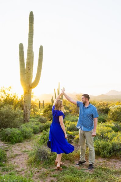 Couple dance together during their Superstitions Mountain engagement session by Apache Junction engagement photographer PMA Photography.