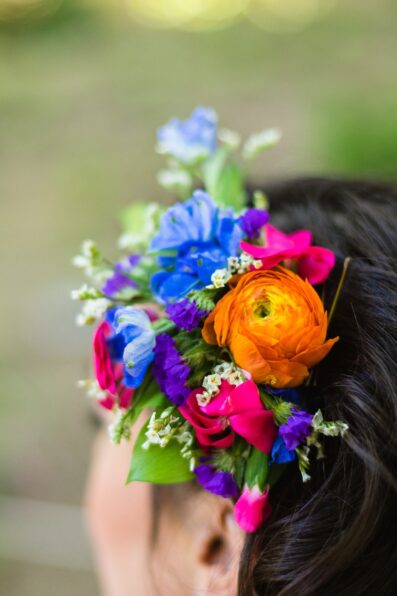 Bride's bright and bold colorful hair piece by PMA Photography.
