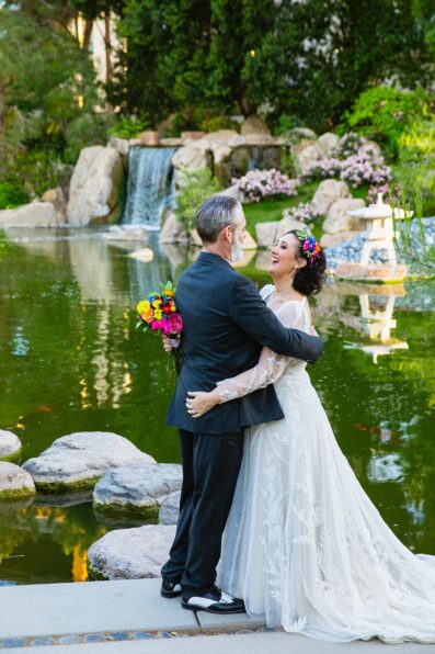 Bride and groom laughing together during their Japanese Friendship Garden wedding by Phoenix wedding photographer PMA Photography.