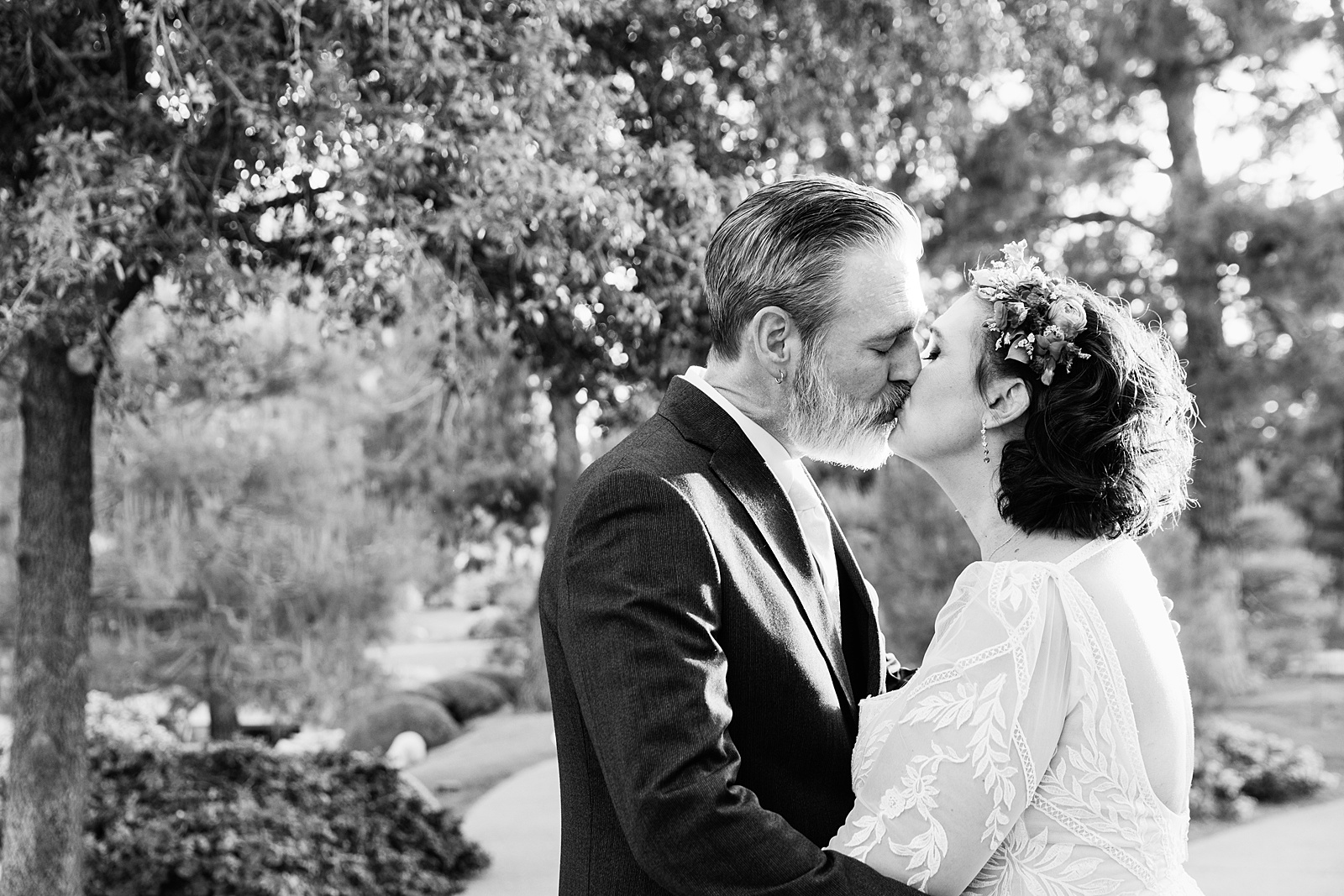 Bride and groom share a kiss during their Japanese Friendship Garden wedding by Phoenix wedding photographer PMA Photography.