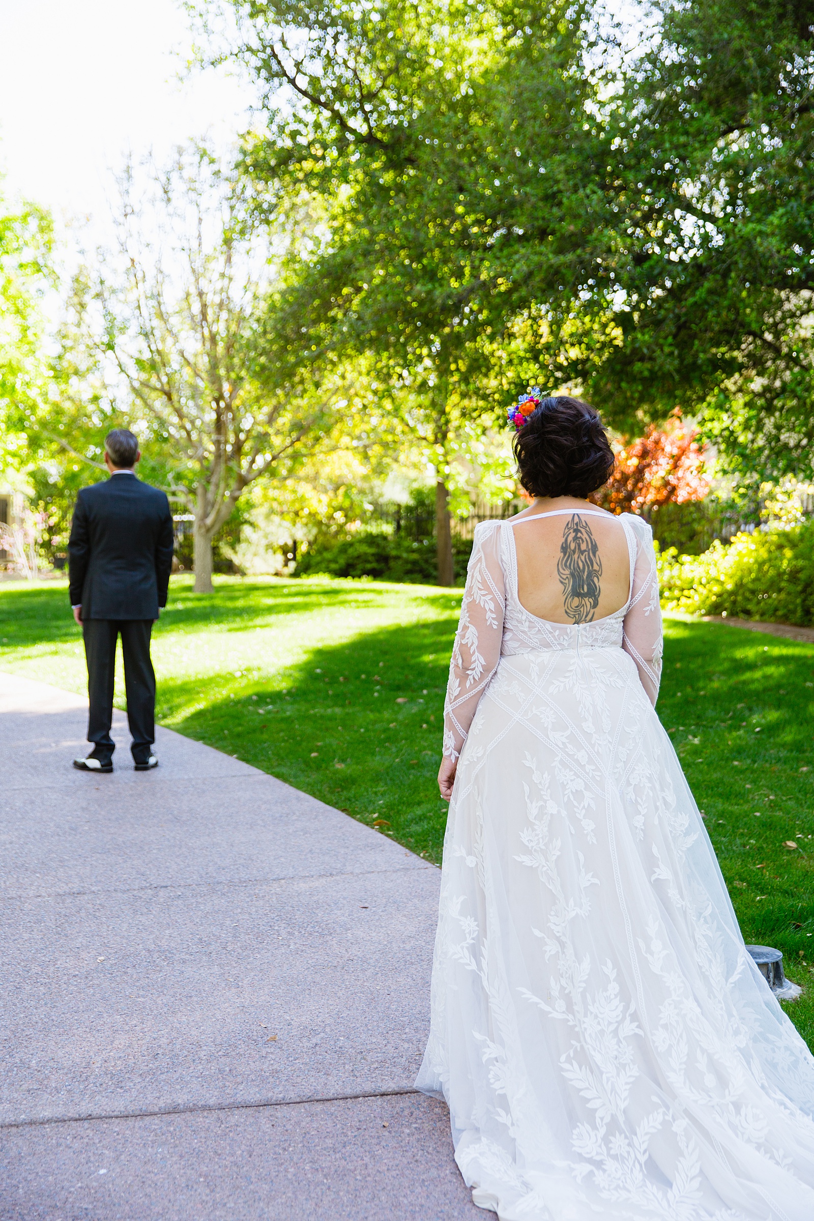 Bride and groom's first look at Japanese Friendship Garden by Phoenix wedding photographer PMA Photography.