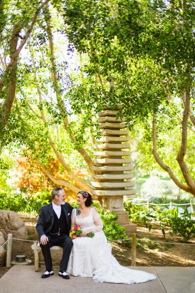 Bride and groom share an intimate moment during their first look at Japanese Friendship Garden by Phoenix wedding photographer PMA Photography.