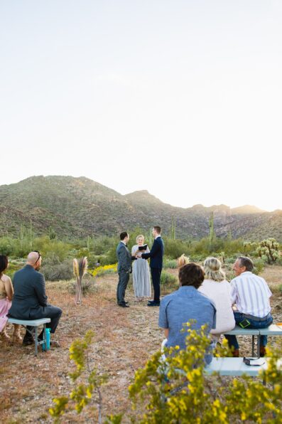 LGBTQ couple togethering during White Tanks wedding ceremony by Phoenix elopement photographer PMA Photography.