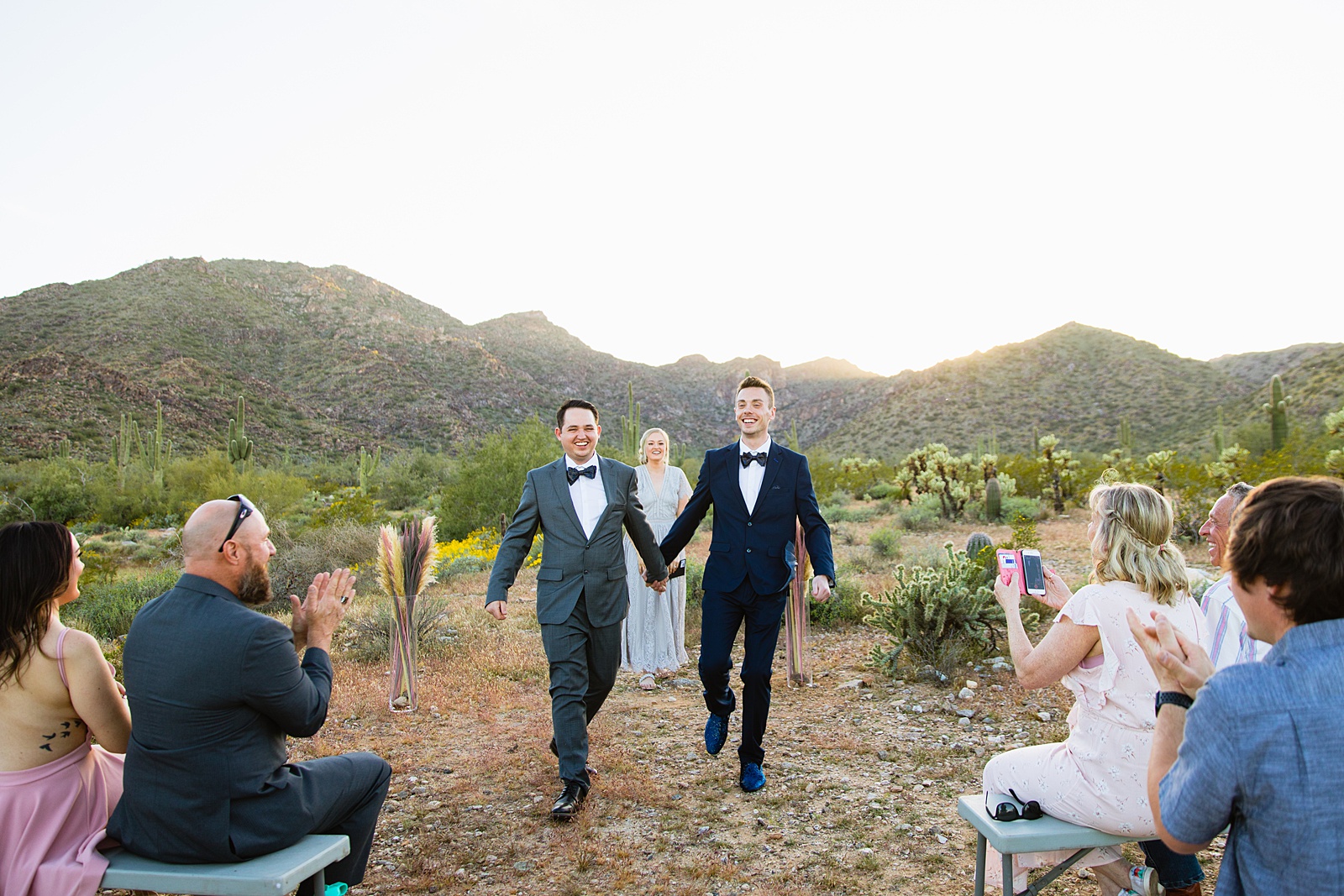 LGBTQ couple walking together as newlyweds by PMA Photography.