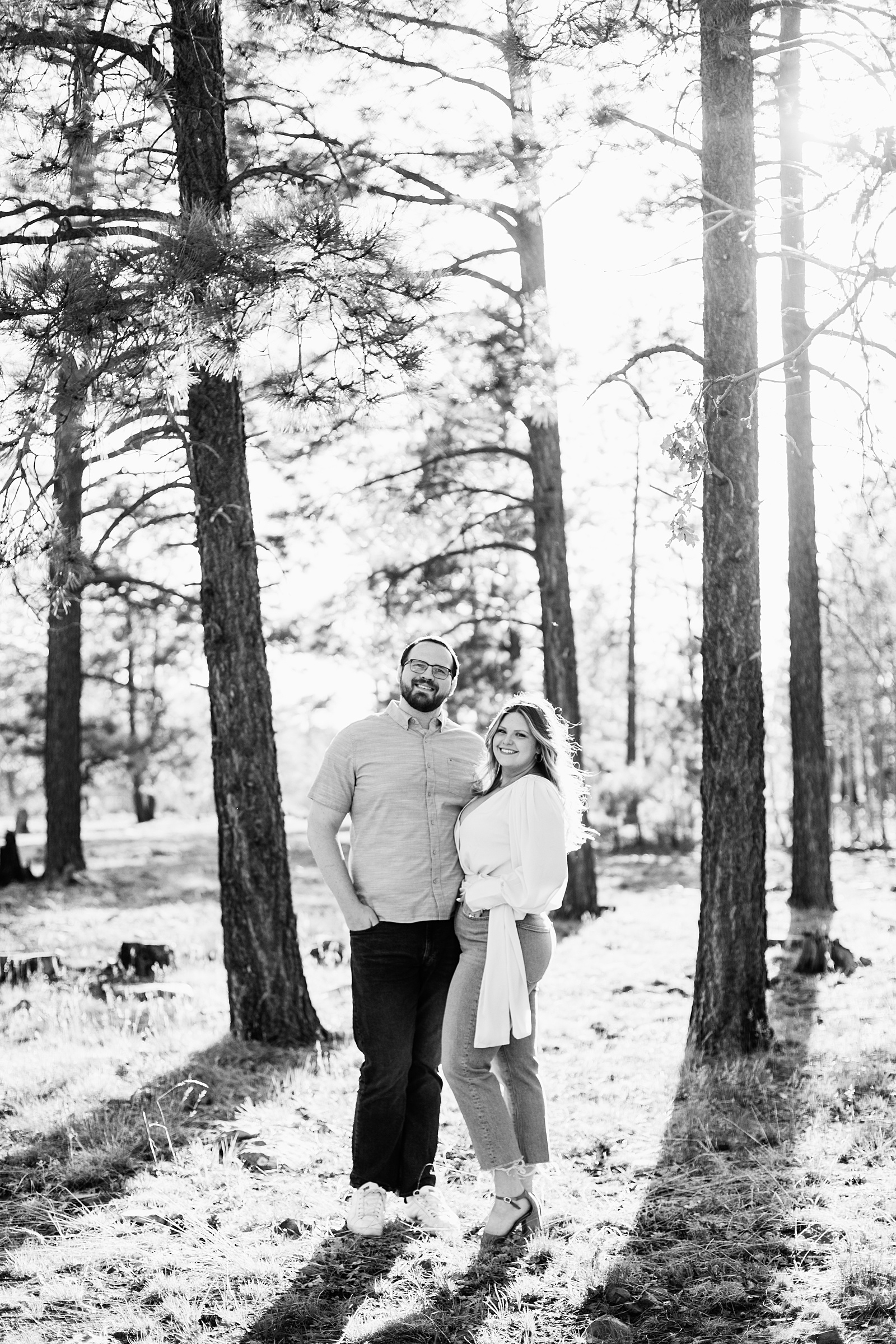 Couple pose during their Payson engagement session by Arizona wedding photographer PMA Photography.