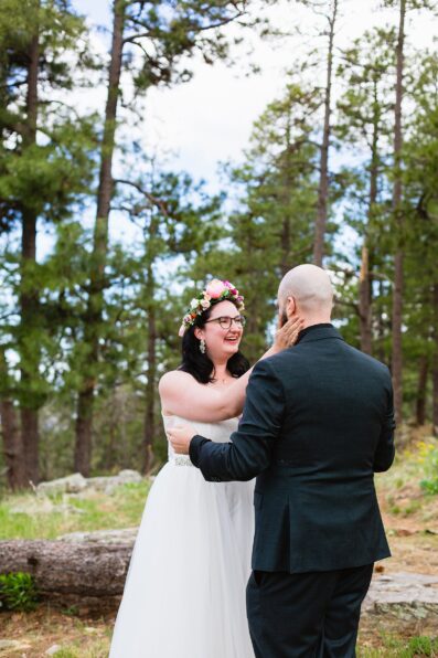 Bride & Groom share an intimate moment during their first look at Mogollon Rim by Arizona elopement photographer PMA Photography.