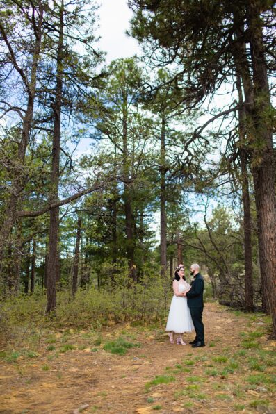 Bride & Groom share an intimate moment during their first look at Mogollon Rim by Arizona elopement photographer PMA Photography.