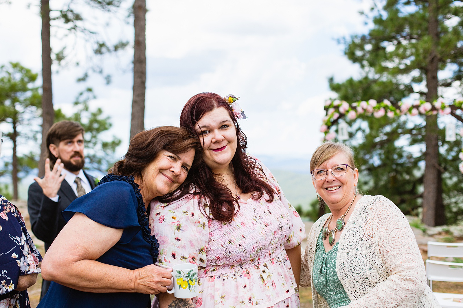 Family during Mogollon Rim wedding ceremony by Arizona elopement photographer PMA Photography.