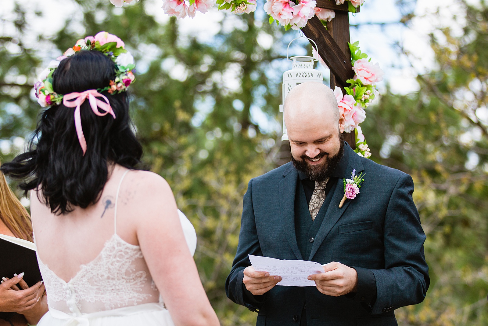 Bride & Groom exchange vows during their wedding ceremony at Mogollon Rim by Arizona elopement photographer PMA Photography.
