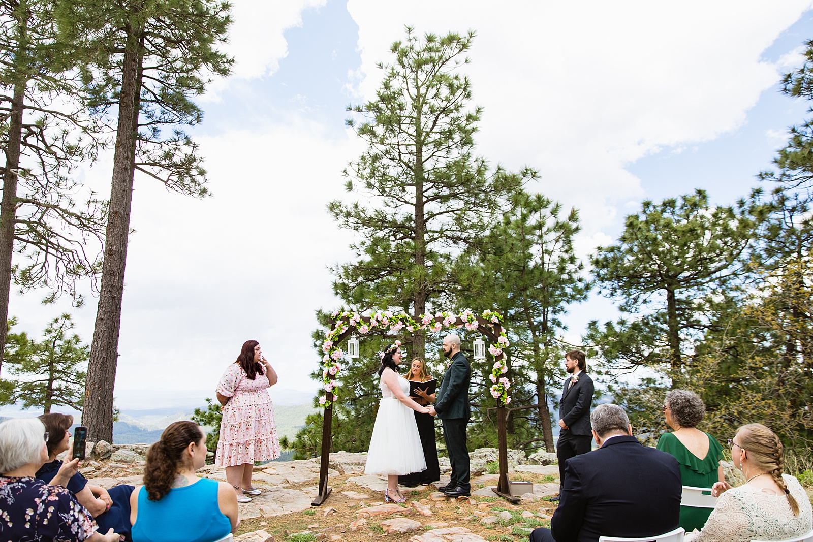 Bride & Groom togethering during Mogollon Rim wedding ceremony by Payson elopement photographer PMA Photography.