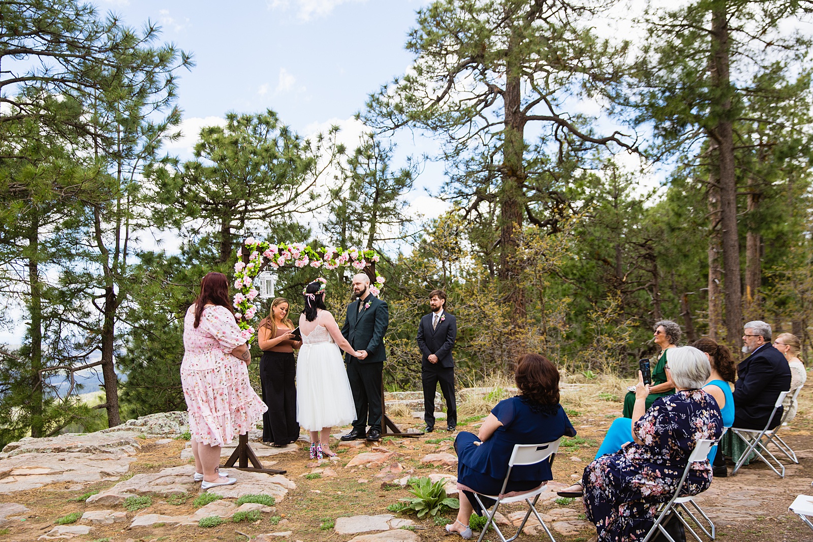 Bride & Groom togethering during Mogollon Rim wedding ceremony by Payson elopement photographer PMA Photography.