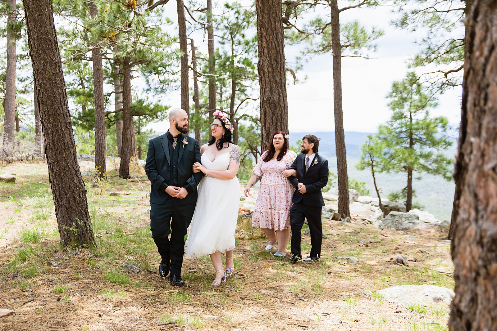 Bride & Groom walking together during their Mogollon Rim elopement by Arizona elopement photographer PMA Photography.