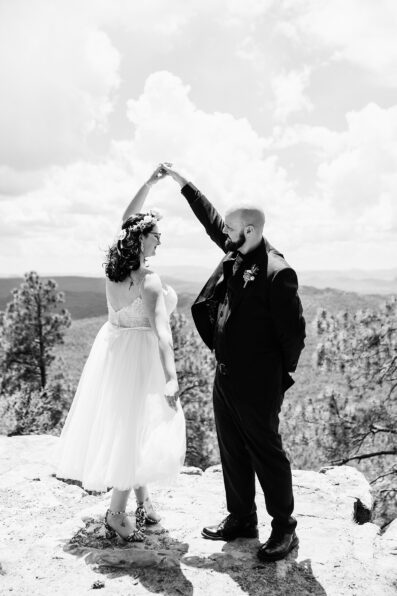 Bride & Groom dancing together during their Mogollon Rim elopement by Payson elopement photographer PMA Photography.
