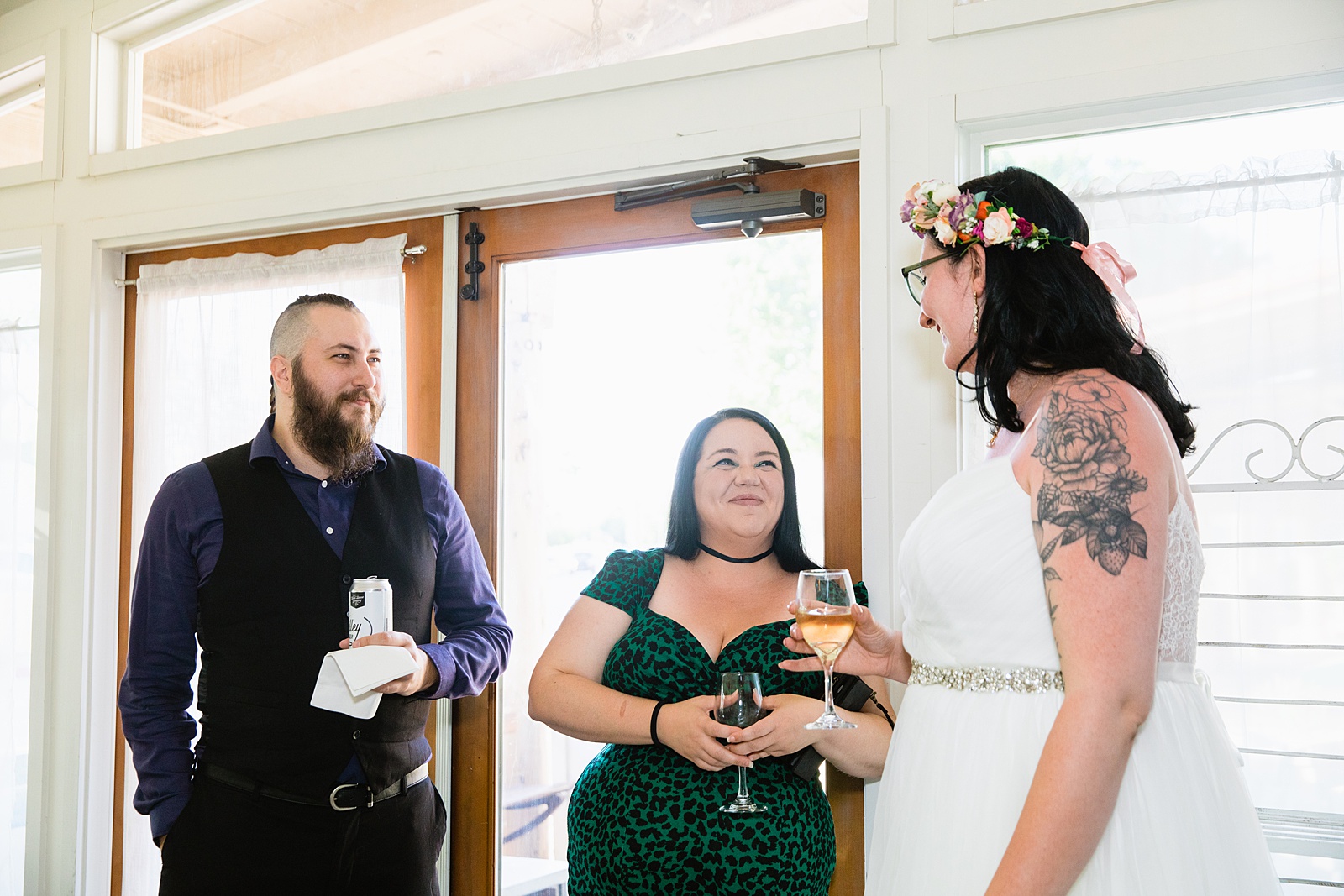 Bride with guests at Pizzeria Bianco wedding reception by Phoenix wedding photographer PMA Photography