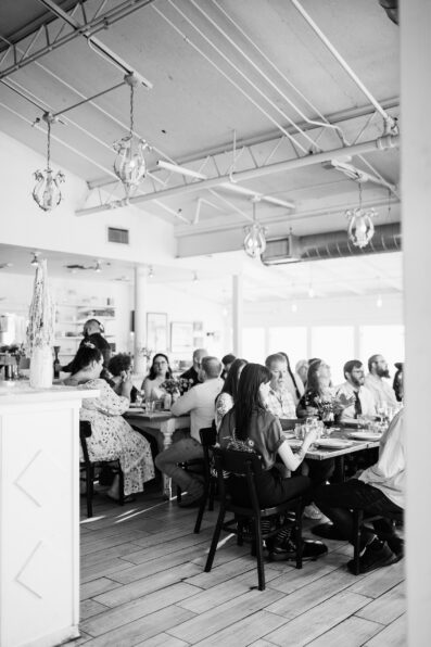 Guests together at Pizzeria Bianco wedding reception by Phoenix wedding photographer PMA Photography