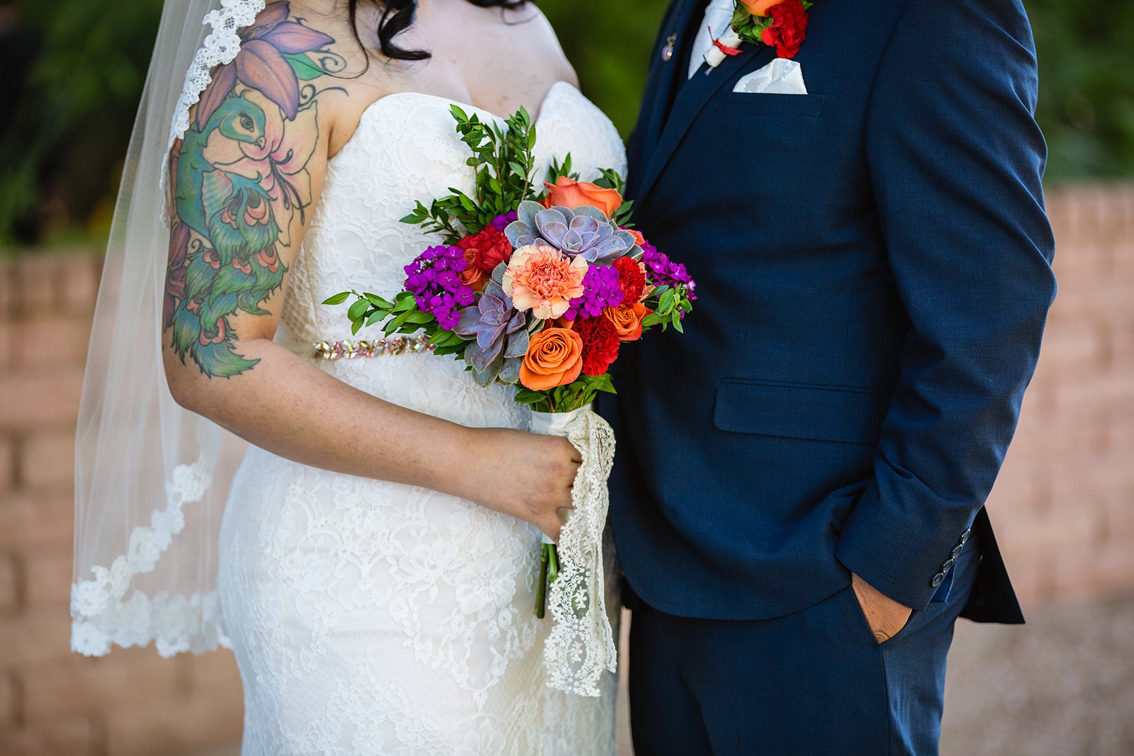 Romantic bride and groom's wedding day outfits at a colorful fiesta wedding.