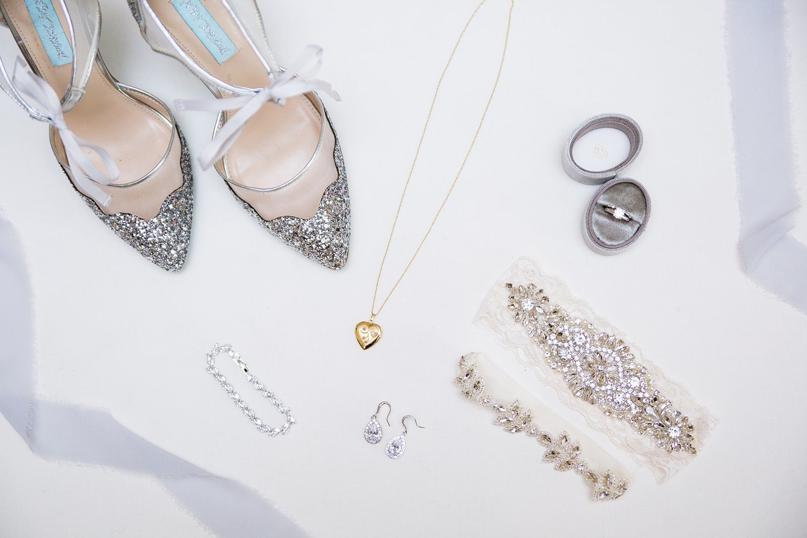 Brides silver and white gold wedding day details by PMA Photography.
