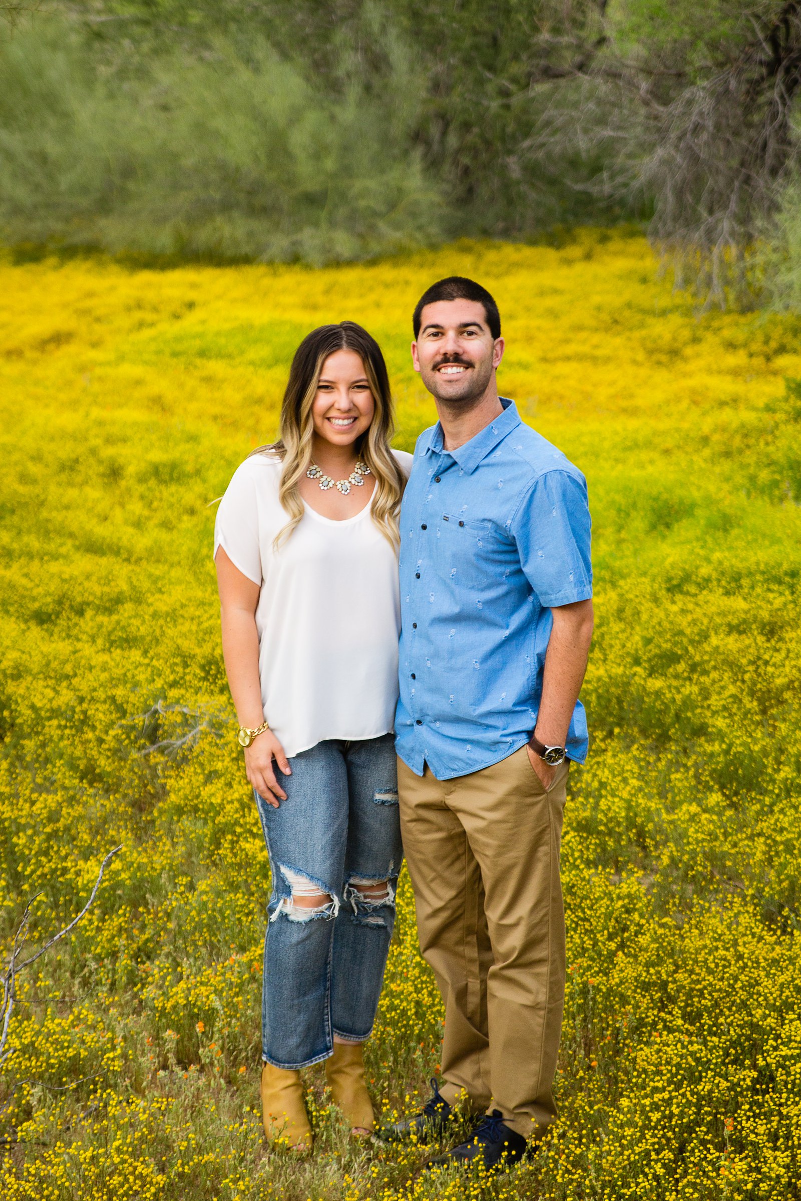 Couple pose for their Spring Thunderbird Mountain engagement session by Phoenix wedding photographer PMA Photography.