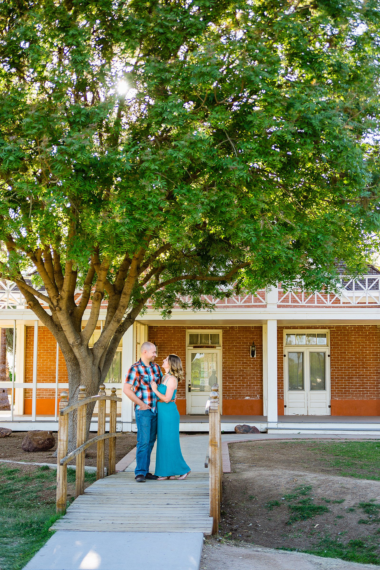 Couple pose for their Sahuaro Ranch engagement session by Phoenix wedding photographer PMA Photography.