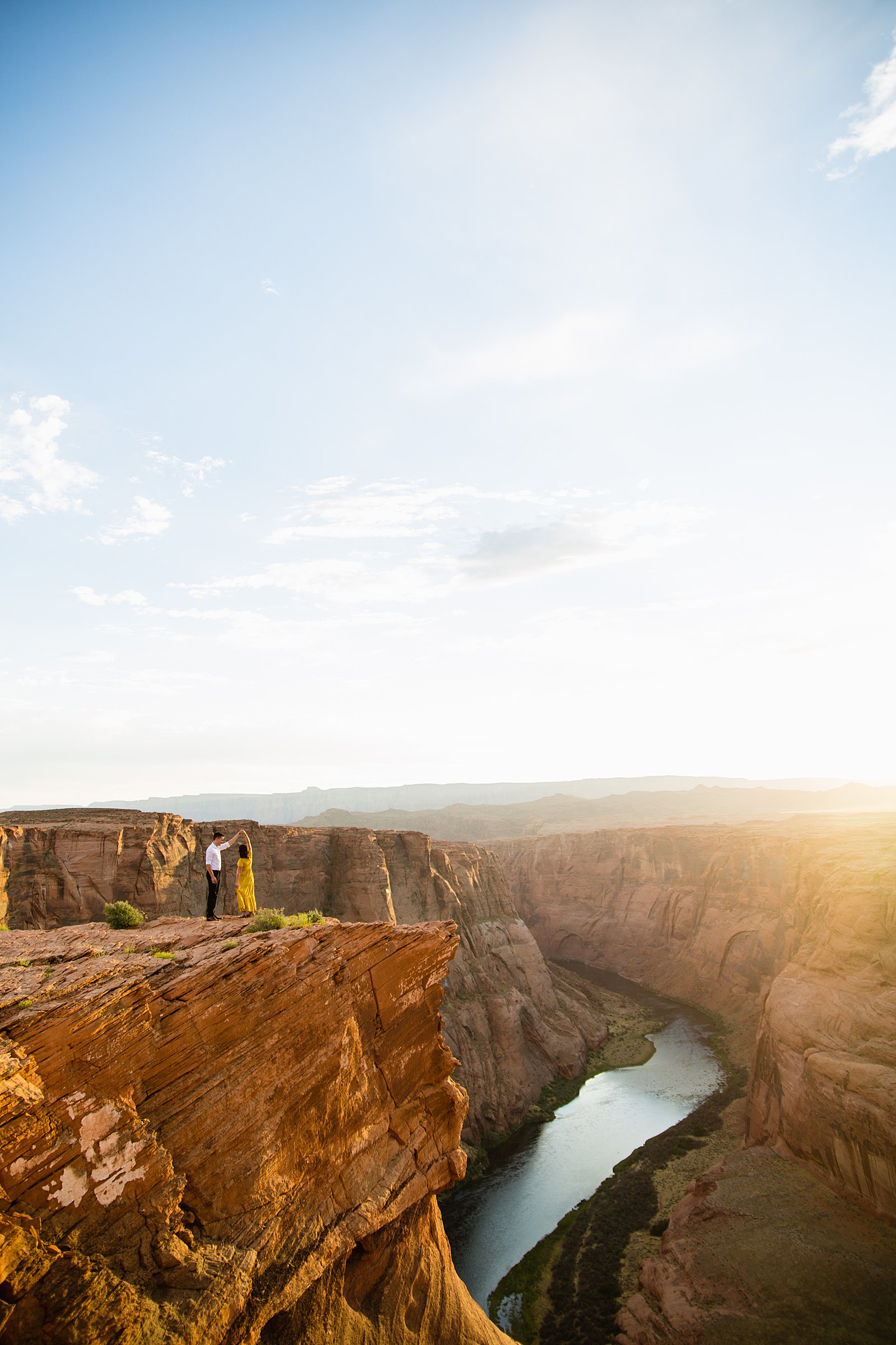 Epic photo of a couple during their Horshoe Bend engagement session by Page wedding photographer PMA Photography.
