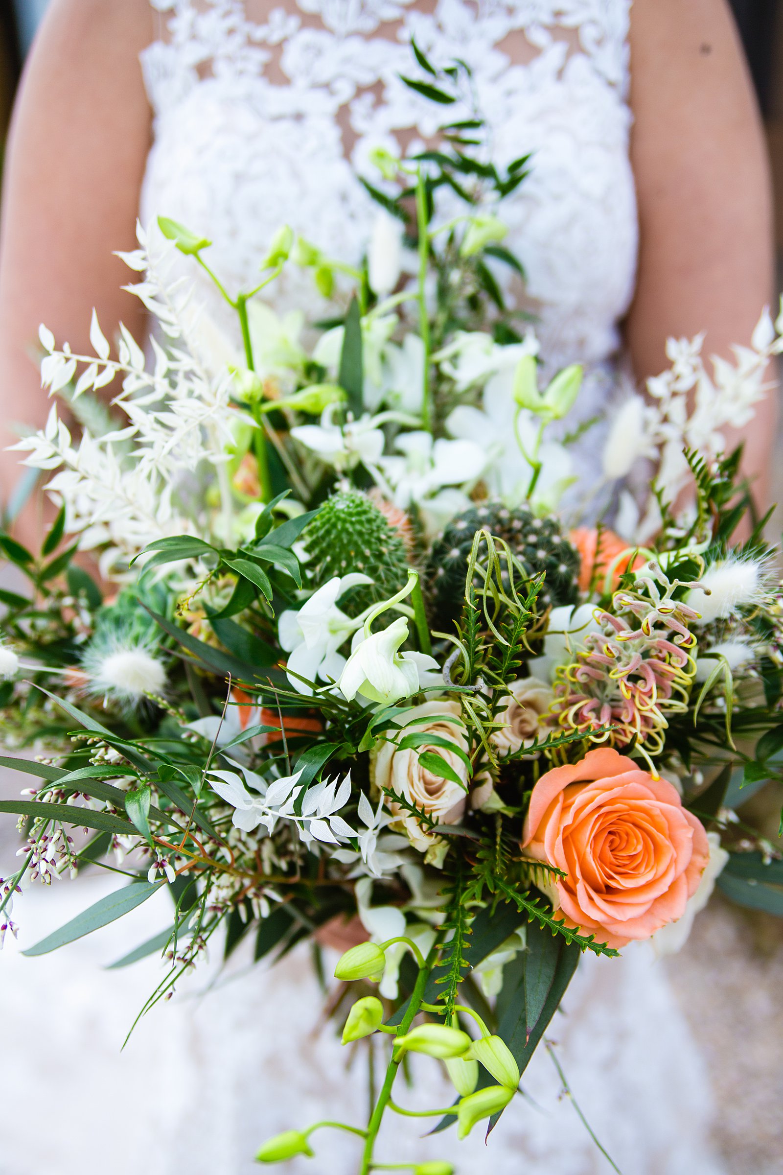Brid'es large, wild desert inspired green and peach wedding bouquet by PMA Photography.