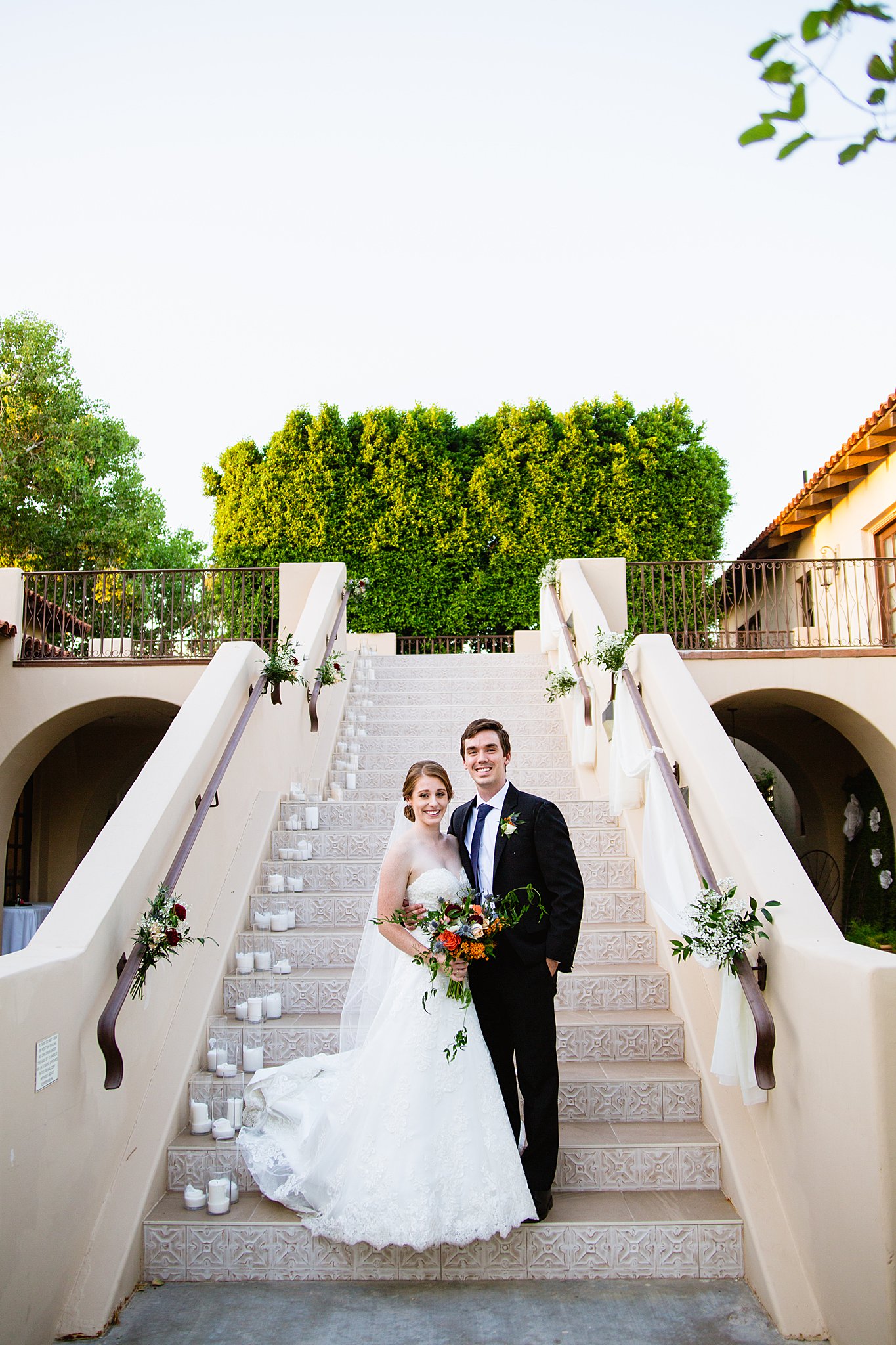 Bride and Groom pose during their Secret Garden Events wedding by Arizona wedding photographer PMA Photography.
