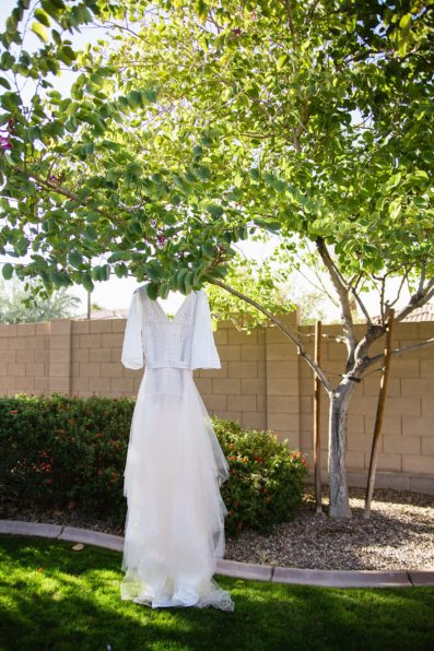 Bride's boho wedding dress for her backyard wedding by PMA Photography.