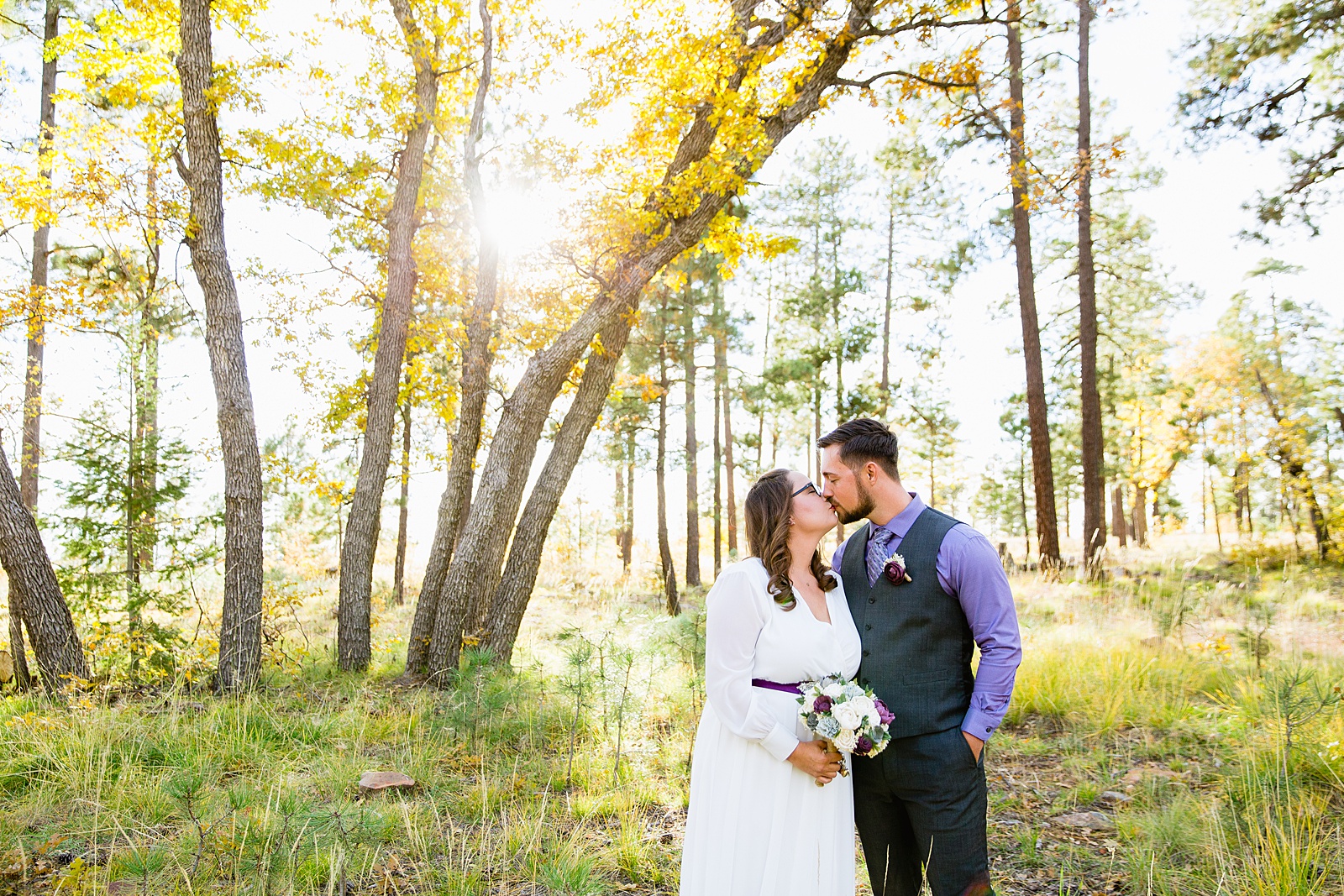 Bride and Groom share a kiss during their Mogollon Rim elopement by Arizona elopement photographer PMA Photography.