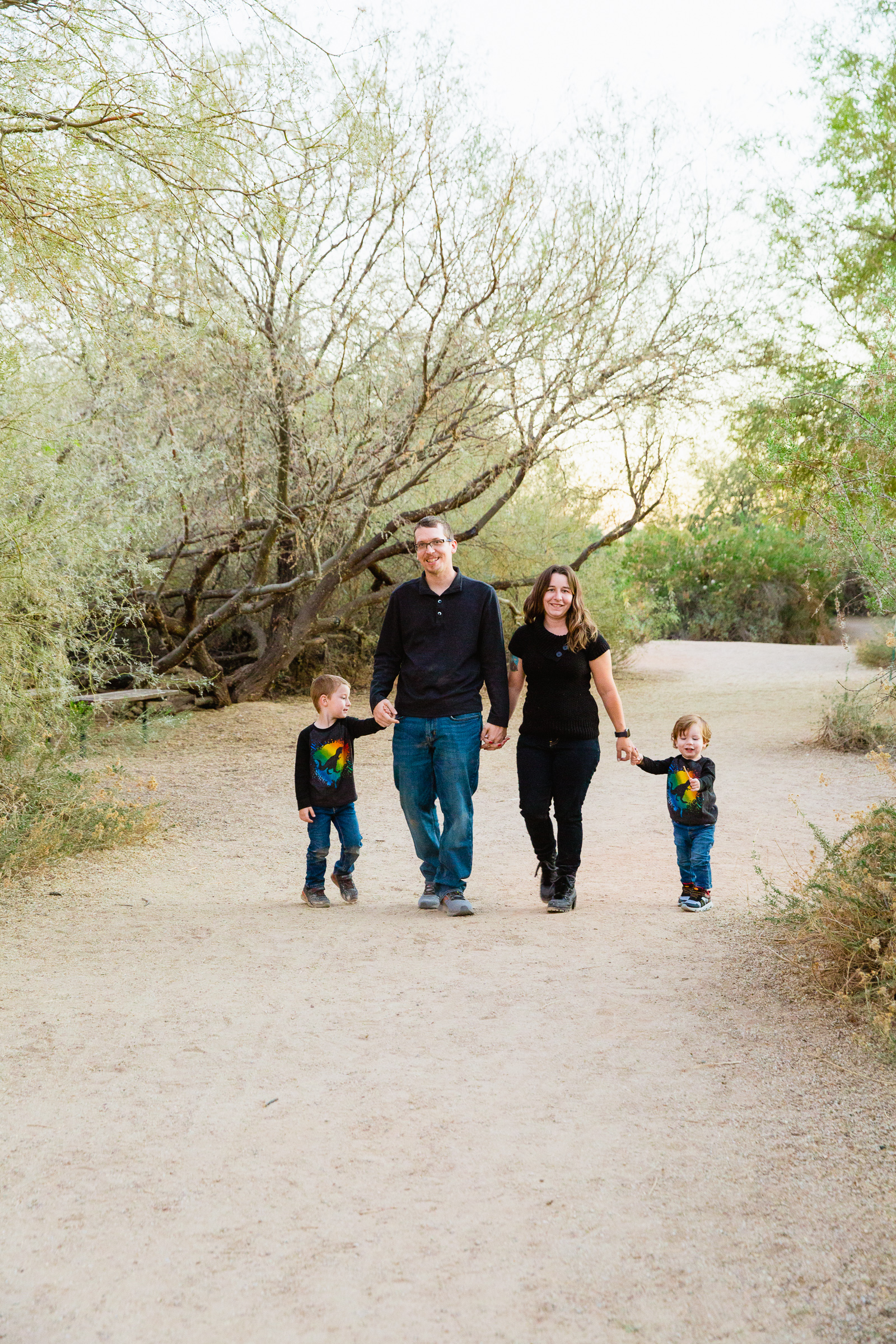 Family walking together during their Gilbert family session by Arizona family photographer PMA Photography.