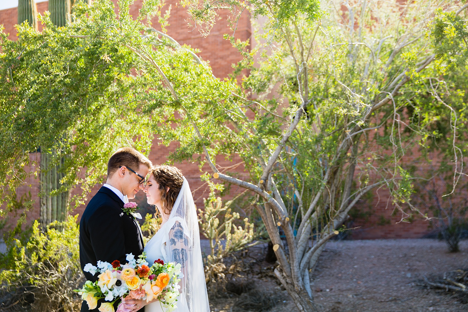 Bride and Groom share an intimate moment at their Arizona Heritage Center wedding by Arizona wedding photographer PMA Photography.