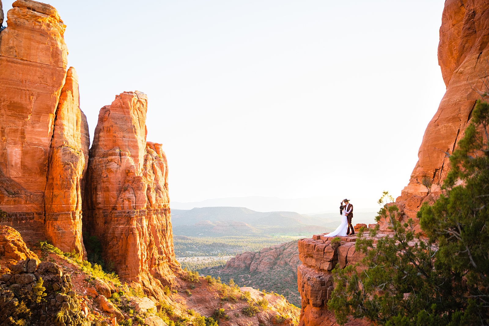 Elopement at the top of Cathedral Rock at sunset by Sedona elopement photographer PMA Photography.