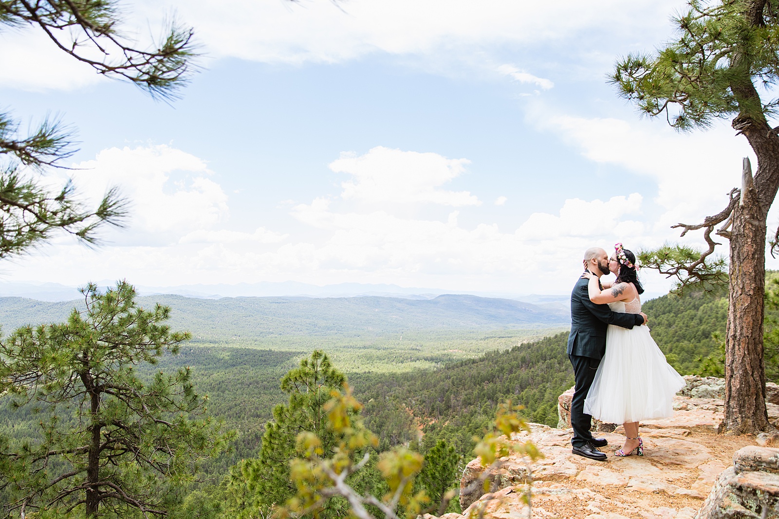Bride & Groom share a kiss during their Mogollon Rim elopement by Payson elopement photographer PMA Photography.